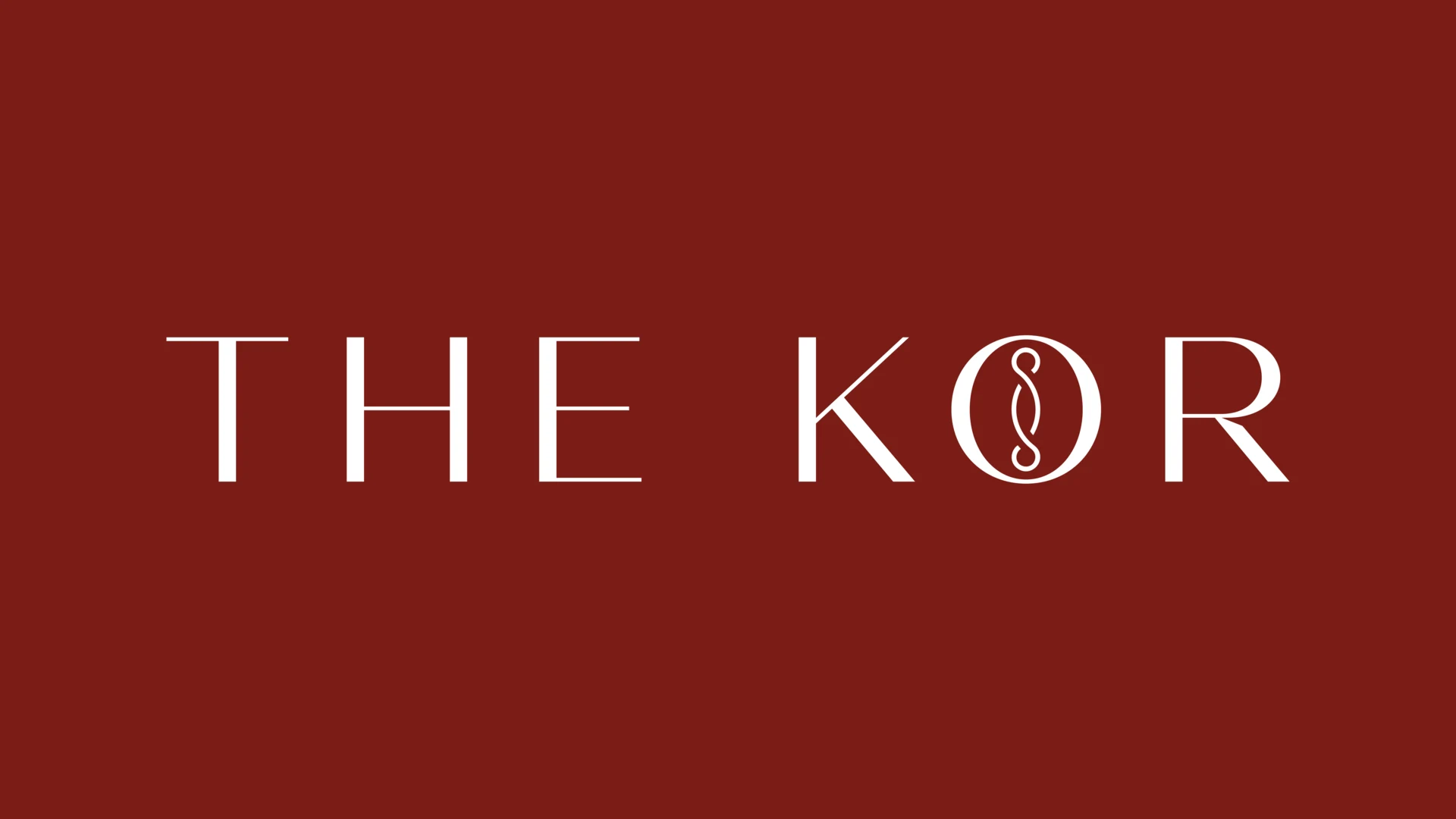 THE KOR's white wordmark on the restaurant brand's deep ember-red background